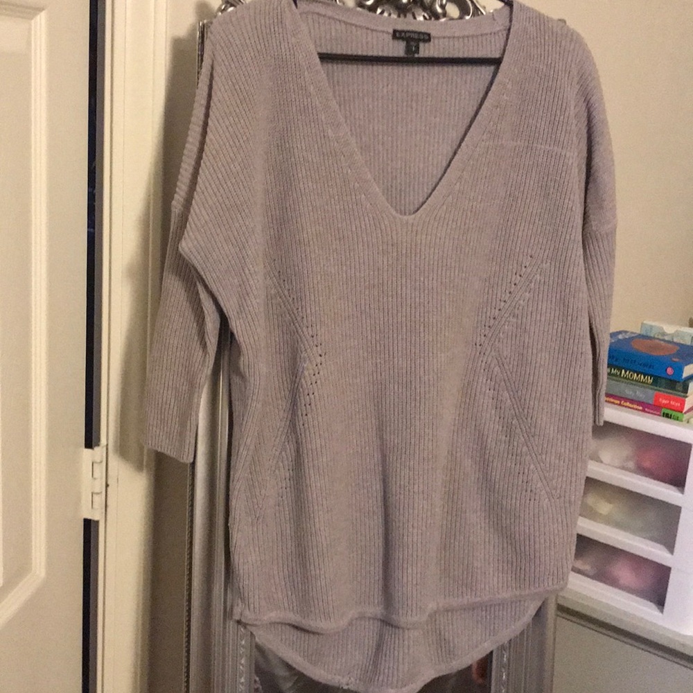 Express sweater. Small snag at bottom inside hem